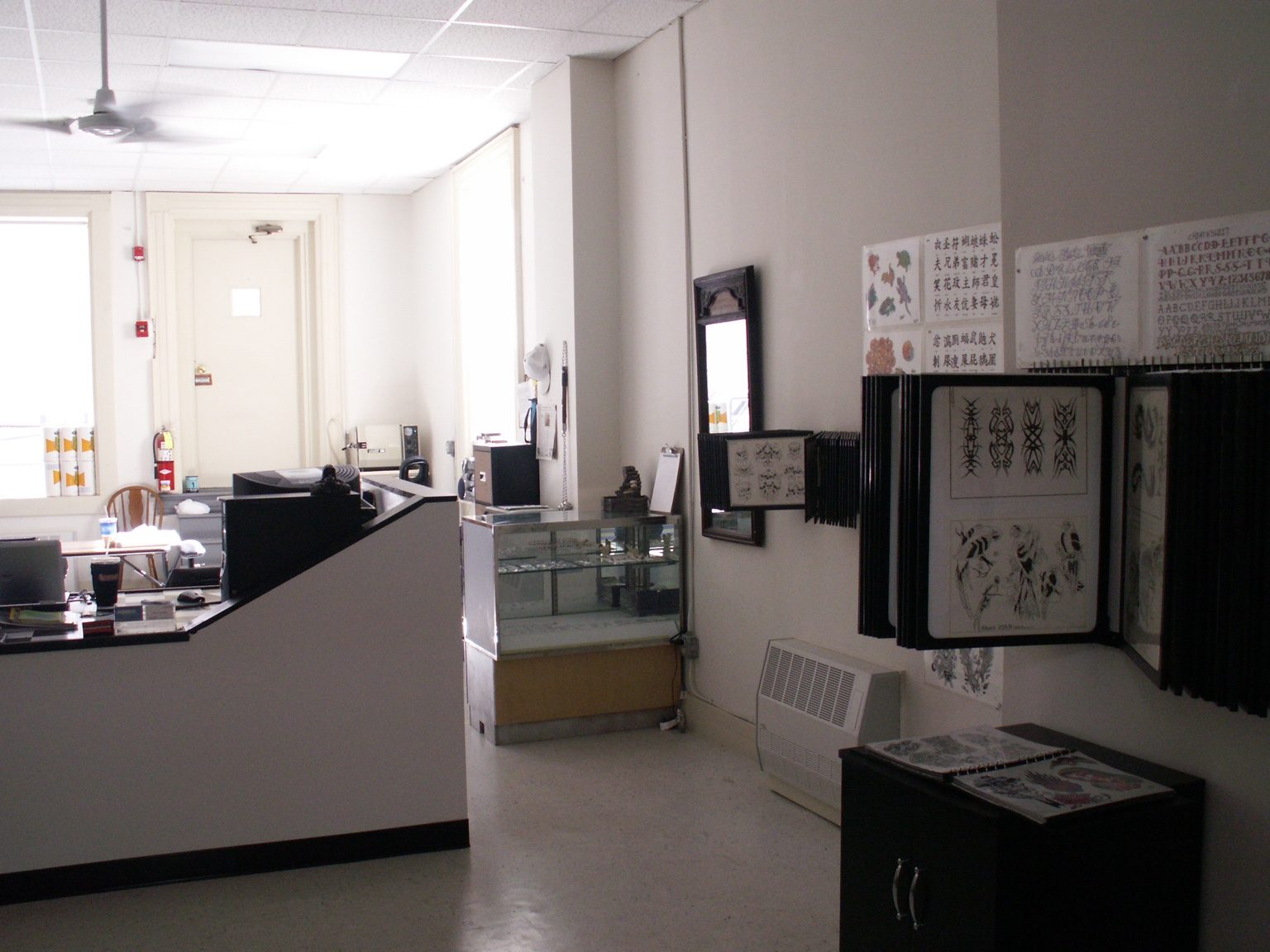 Original Mountainside Tattoo interior with tattoo flash and display cases
